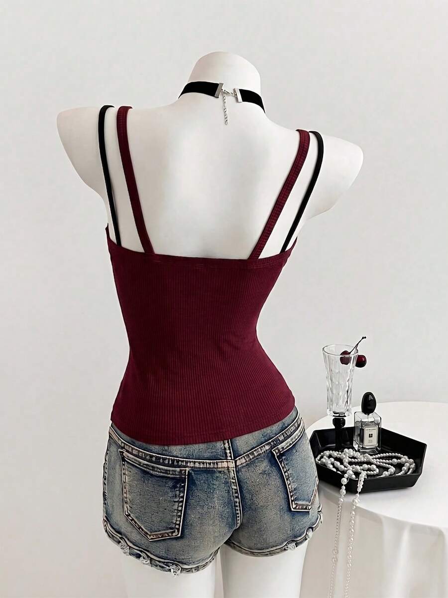 Women's slim fit spaghetti strap cami tank top with contrast lace trim along the neckline