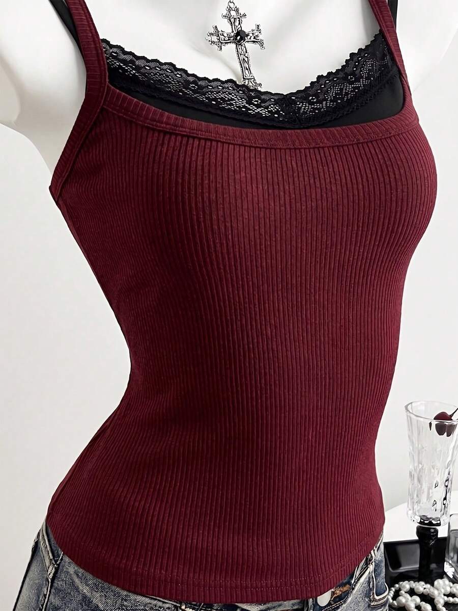 Women's slim fit spaghetti strap cami tank top with contrast lace trim along the neckline