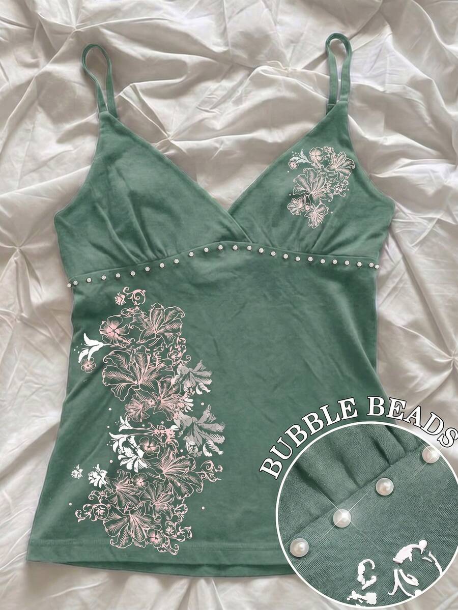 Women's slim fit spaghetti strap cami top featuring a tropical hibiscus floral graphic print.