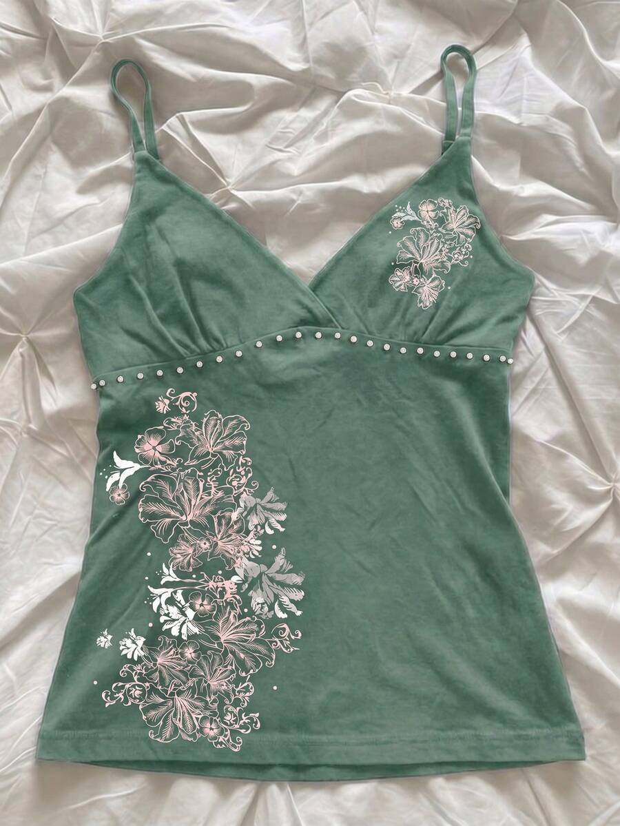 Women's slim fit spaghetti strap cami top featuring a tropical hibiscus floral graphic print.