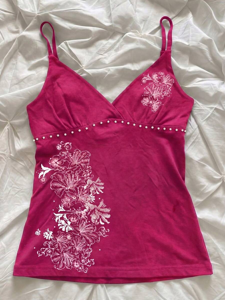 Women's slim fit spaghetti strap cami top featuring a tropical hibiscus floral graphic print.