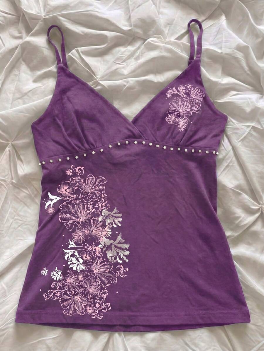 Women's slim fit spaghetti strap cami top featuring a tropical hibiscus floral graphic print.