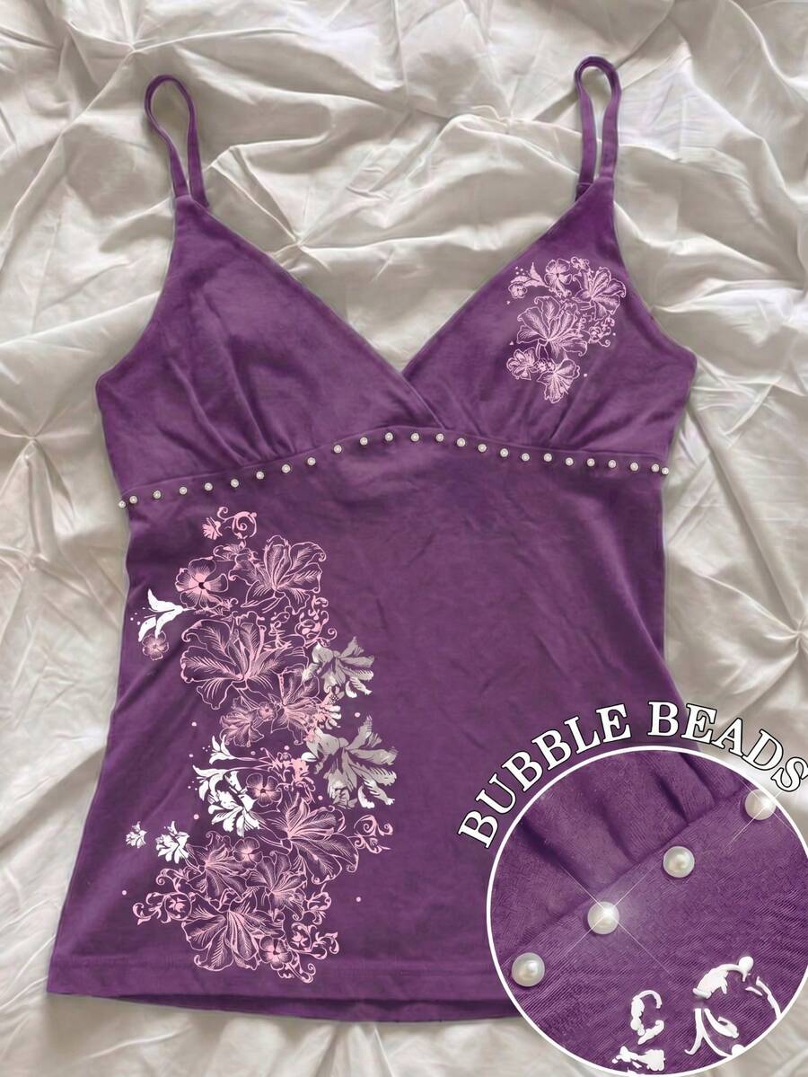 Women's slim fit spaghetti strap cami top featuring a tropical hibiscus floral graphic print.