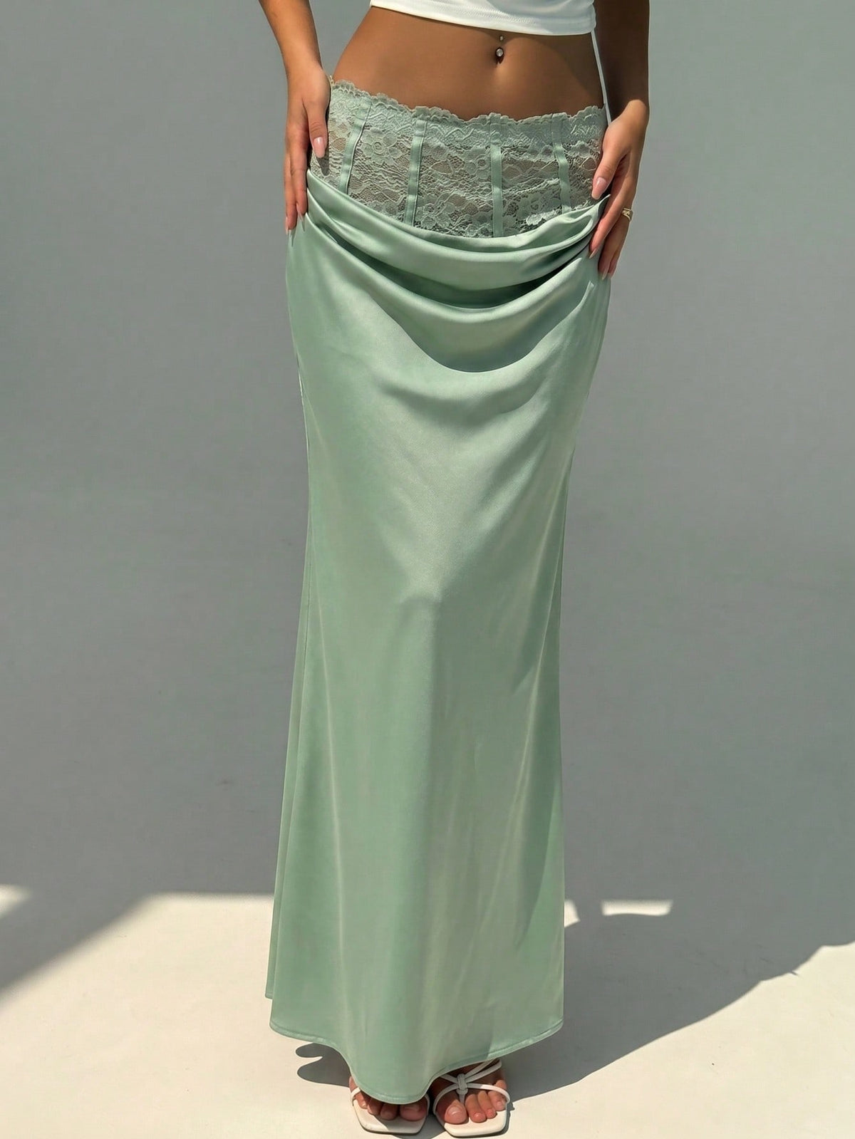 Women's high waist satin mermaid maxi skirt featuring contrast lace patchwork embroidery detail and side slit for formal and evening wear.
