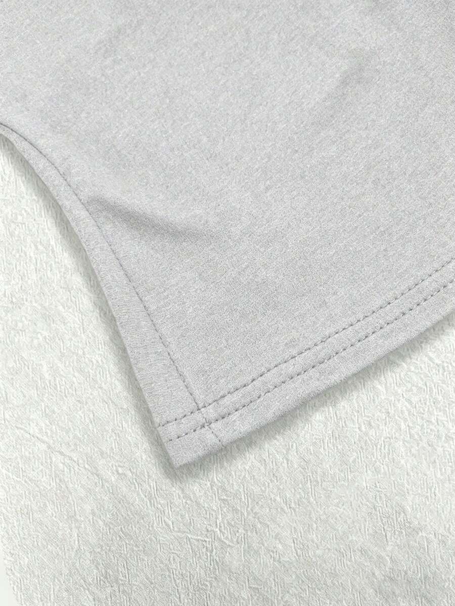 A women's solid slim fit camisole top with delicate contrast lace trim around the neckline and spaghetti straps.