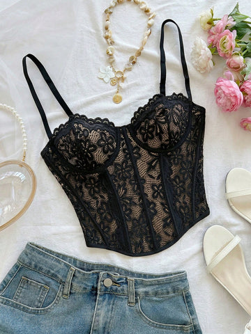 Women's lace bustier camisole top with spaghetti straps, contrast lace, lace-up detail, and an asymmetrical hem in a slim fit design.