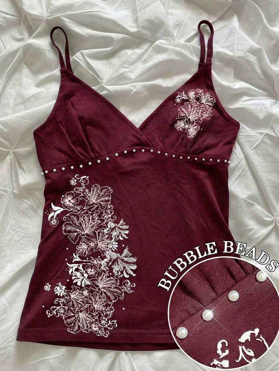 Women's slim fit spaghetti strap cami top featuring a tropical hibiscus floral graphic print.