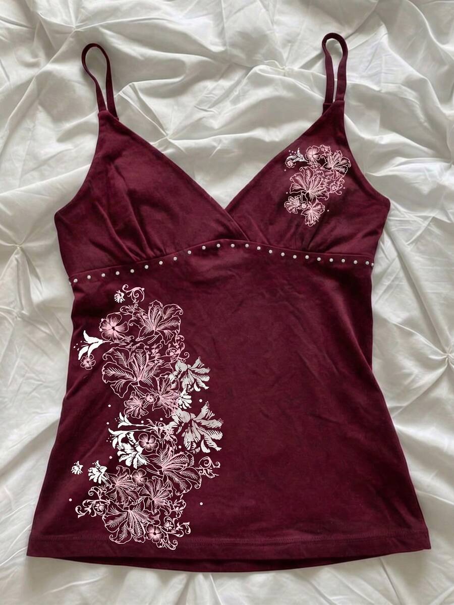 Women's slim fit spaghetti strap cami top featuring a tropical hibiscus floral graphic print.
