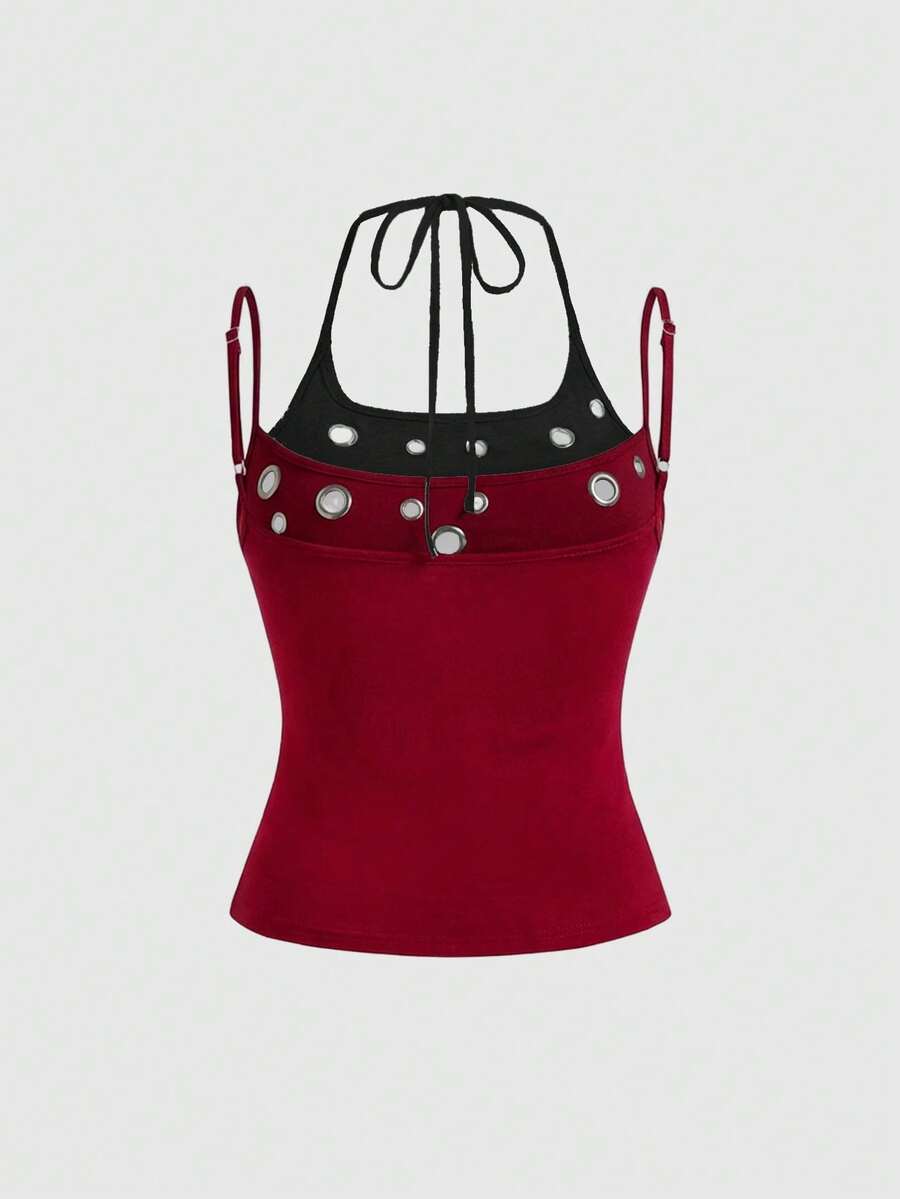 Black halter crop tank top for women featuring lace up front details, ruched accents, and appliques in a slim fit knitted fabric.