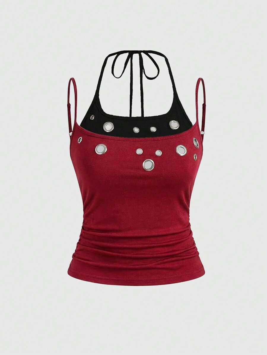 Black halter crop tank top for women featuring lace up front details, ruched accents, and appliques in a slim fit knitted fabric.