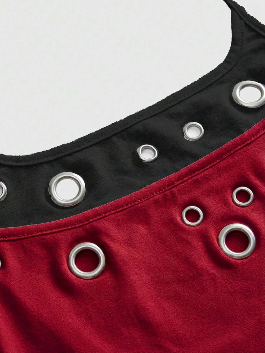 Black halter crop tank top for women featuring lace up front details, ruched accents, and appliques in a slim fit knitted fabric.