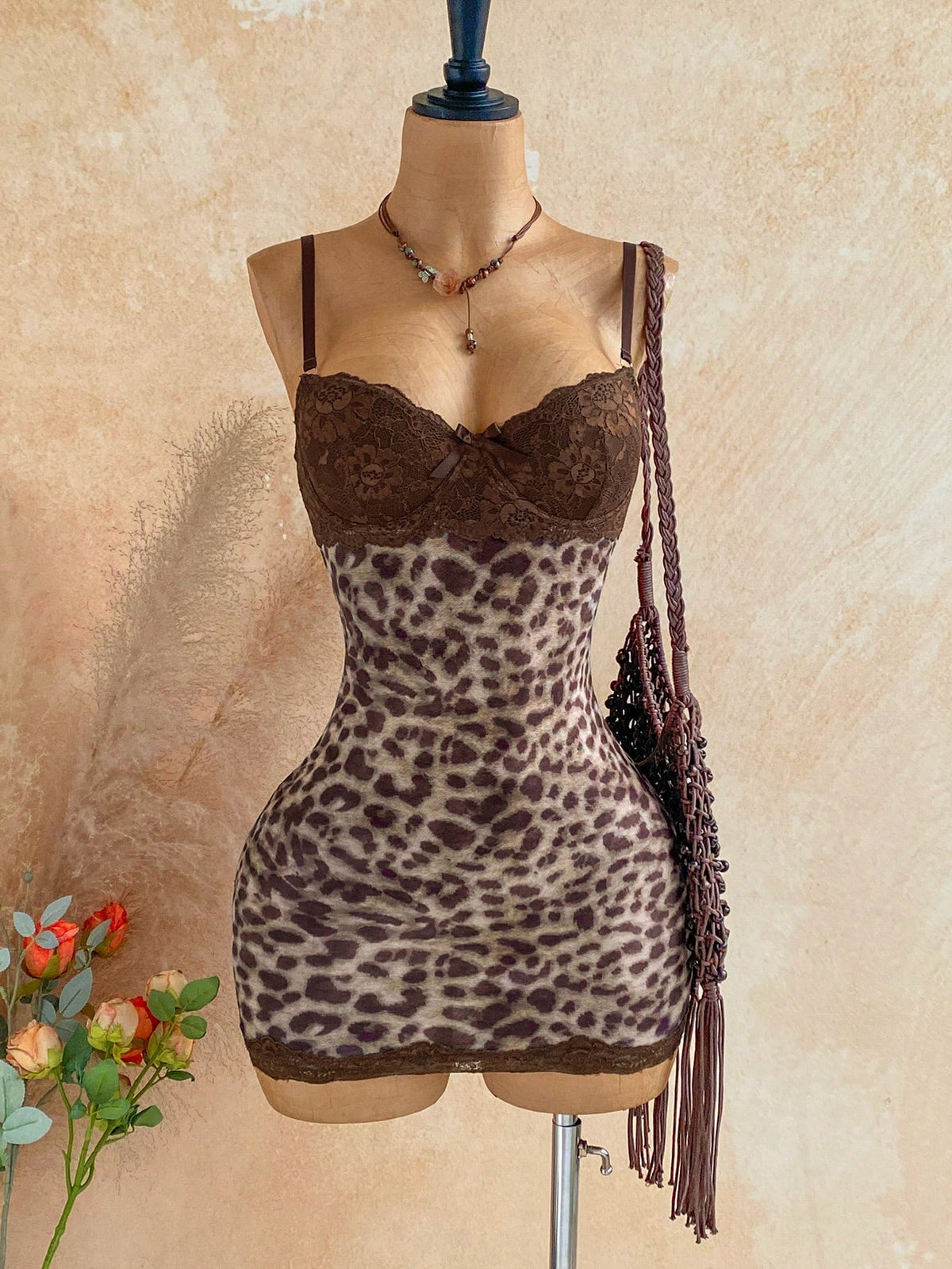 Women's black mesh bodycon mini dress featuring spaghetti straps, contrast lace cup details, backless styling, and a slim fit.