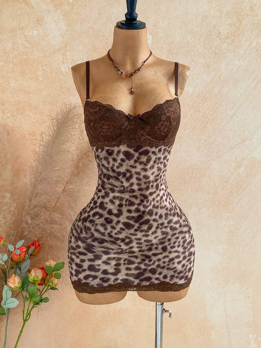 Women's black mesh bodycon mini dress featuring spaghetti straps, contrast lace cup details, backless styling, and a slim fit.