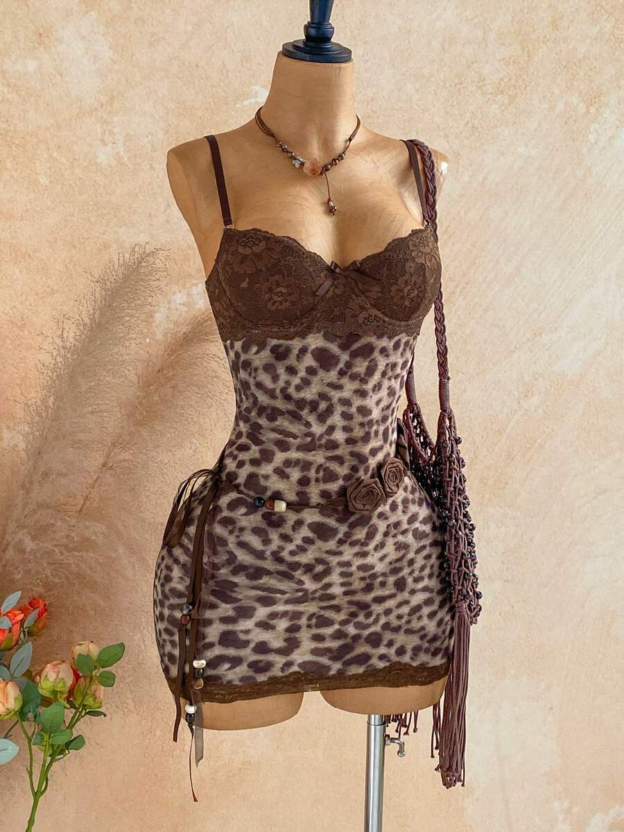 Women's black mesh bodycon mini dress featuring spaghetti straps, contrast lace cup details, backless styling, and a slim fit.