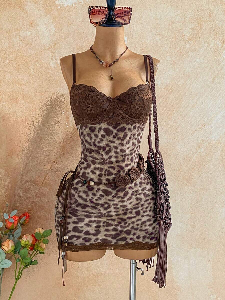Women's black mesh bodycon mini dress featuring spaghetti straps, contrast lace cup details, backless styling, and a slim fit.