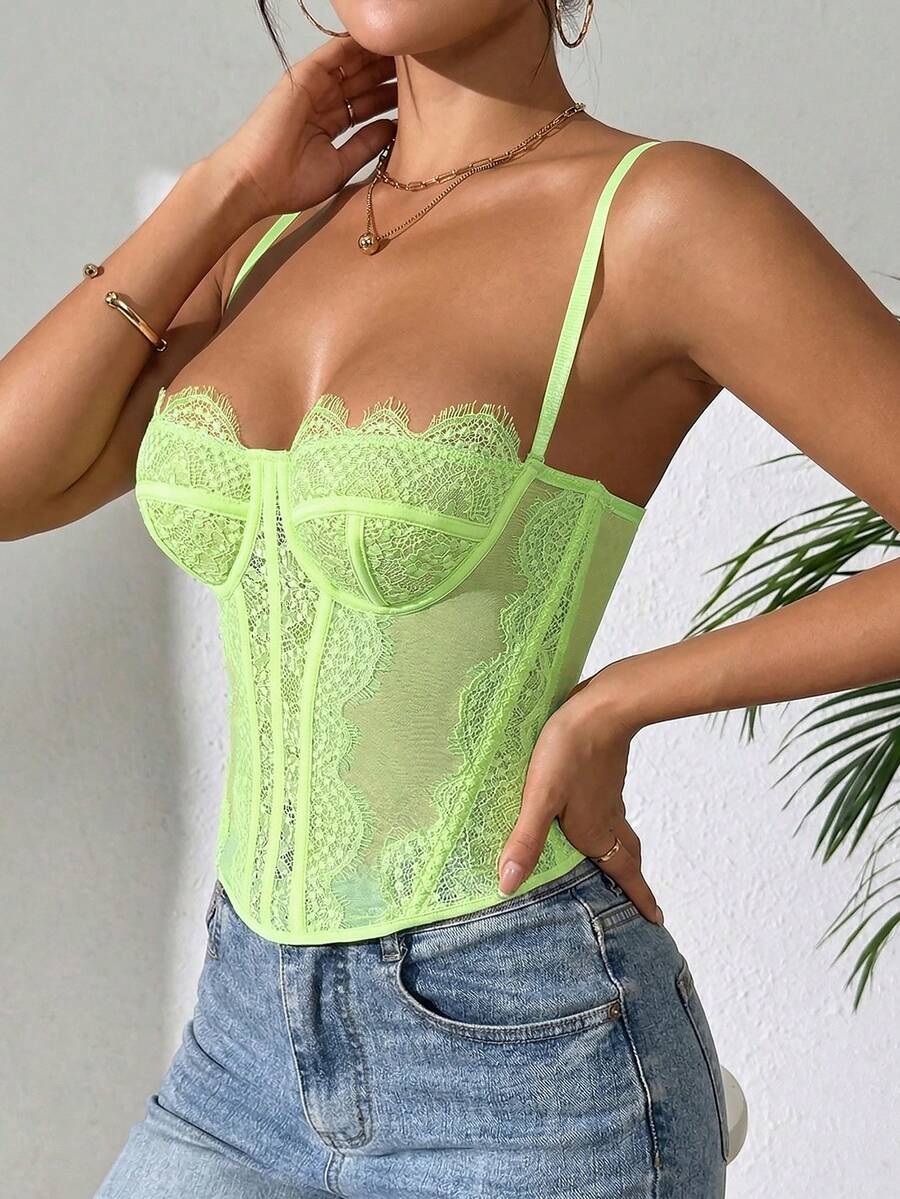 Women's brown lace trim cami corset crop top featuring a low cut neck, unlined body, and slim fit bodycon silhouette.