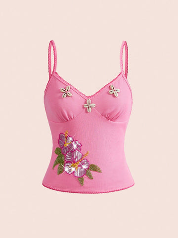 Pink women's slim fit camisole top featuring hibiscus floral embroidery, thin spaghetti straps, and high-stretch knitted fabric.