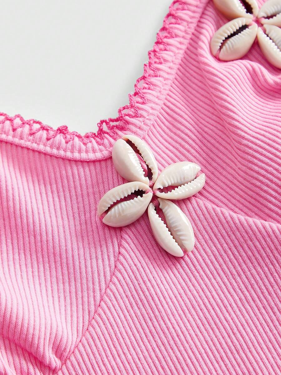 Pink women's slim fit camisole top featuring hibiscus floral embroidery, thin spaghetti straps, and high-stretch knitted fabric.