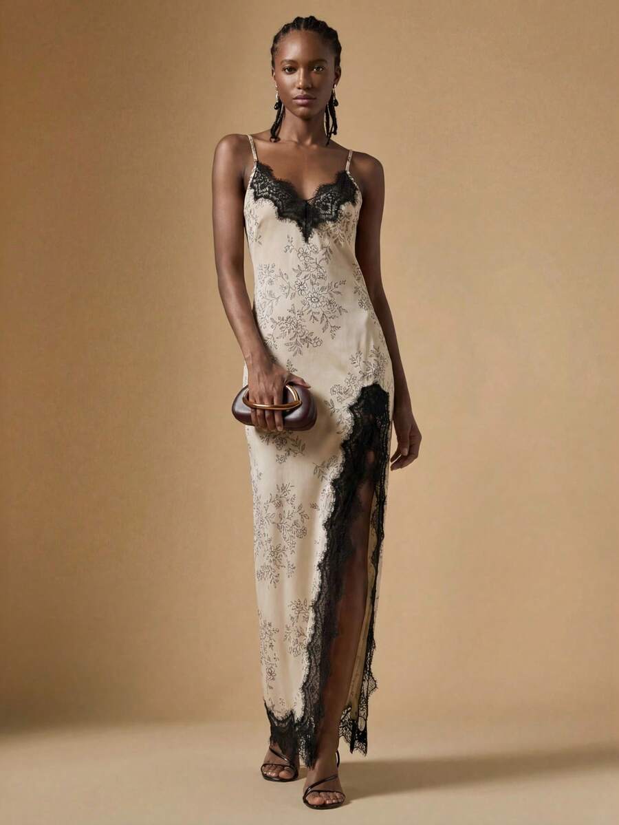 Women's black lace split satin long dress featuring spaghetti straps, asymmetrical slit hem, and matching arm sleeves.