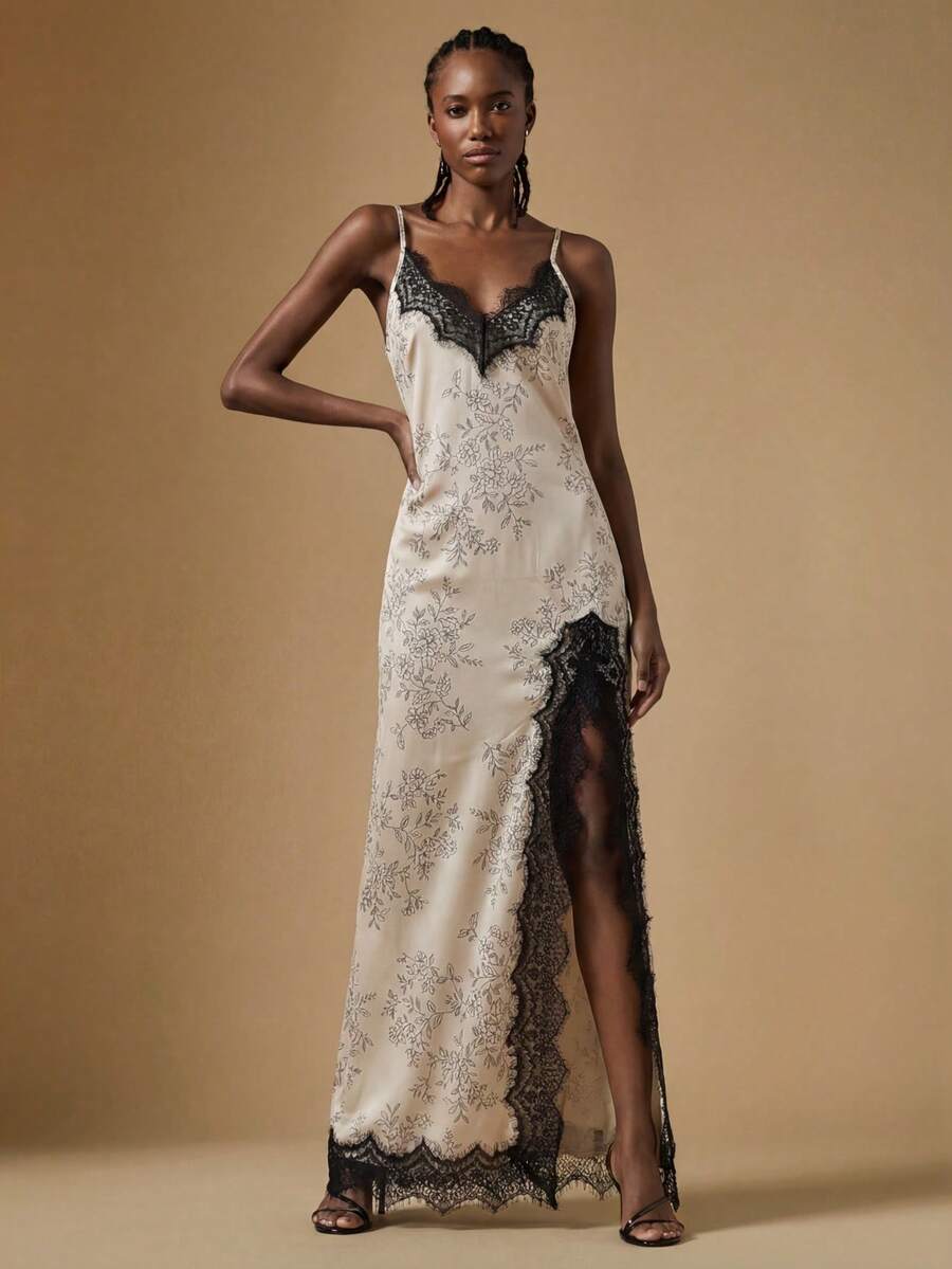 Women's black lace split satin long dress featuring spaghetti straps, asymmetrical slit hem, and matching arm sleeves.