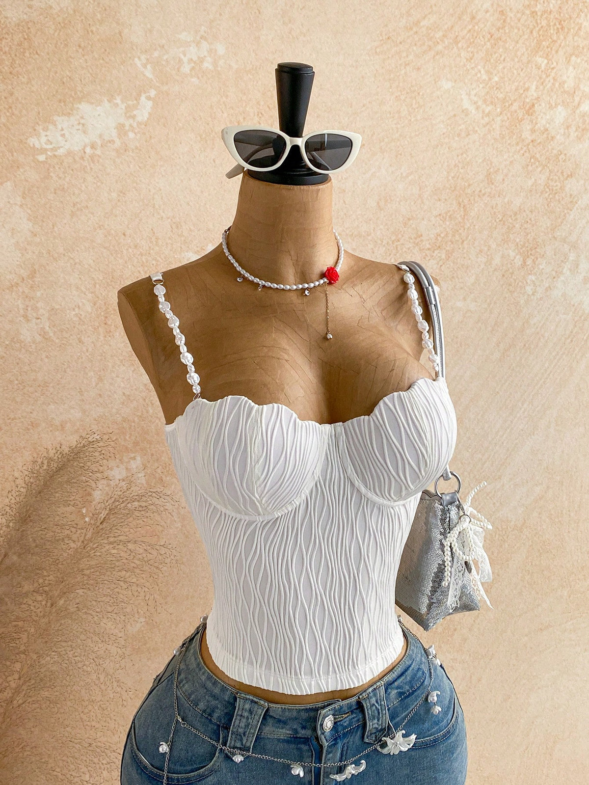 Women's black molded cup camisole top with scallop detailing and spaghetti straps.
