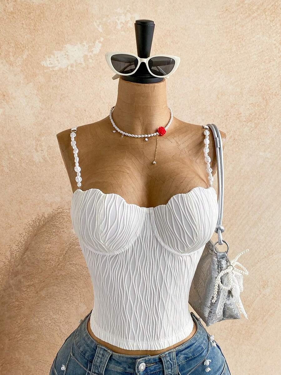 Women's black molded cup camisole top with scallop detailing and spaghetti straps.