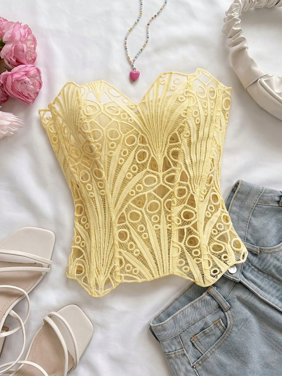 Women’s strapless corset bustier top with lace-up detail, asymmetrical embroidery, semi-sheer finish, and slim fit.