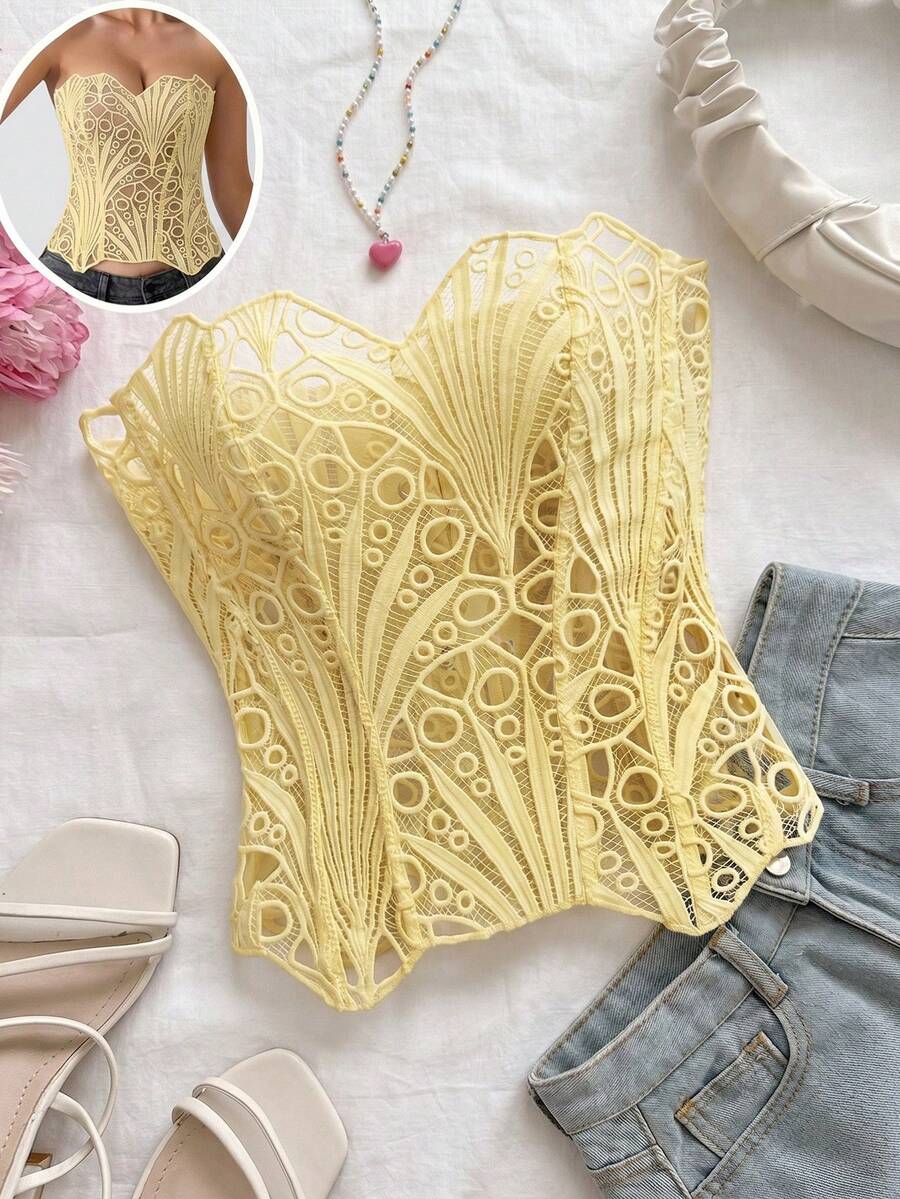 Women’s strapless corset bustier top with lace-up detail, asymmetrical embroidery, semi-sheer finish, and slim fit.