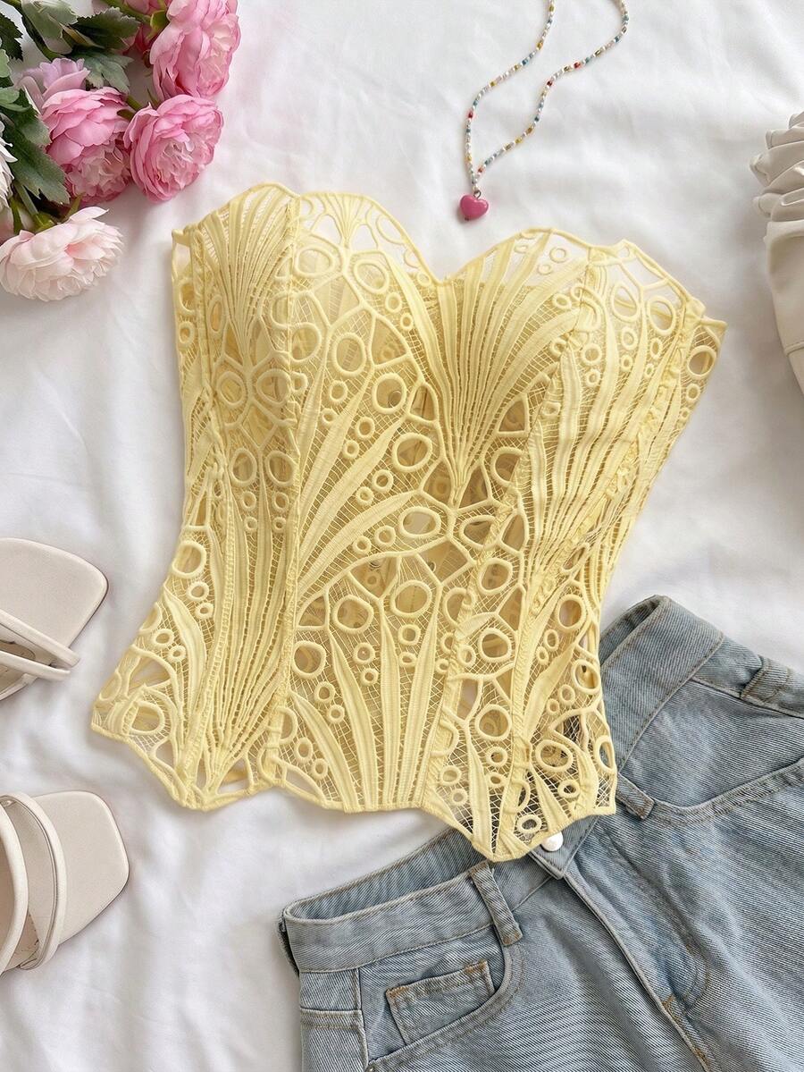 Women’s strapless corset bustier top with lace-up detail, asymmetrical embroidery, semi-sheer finish, and slim fit.