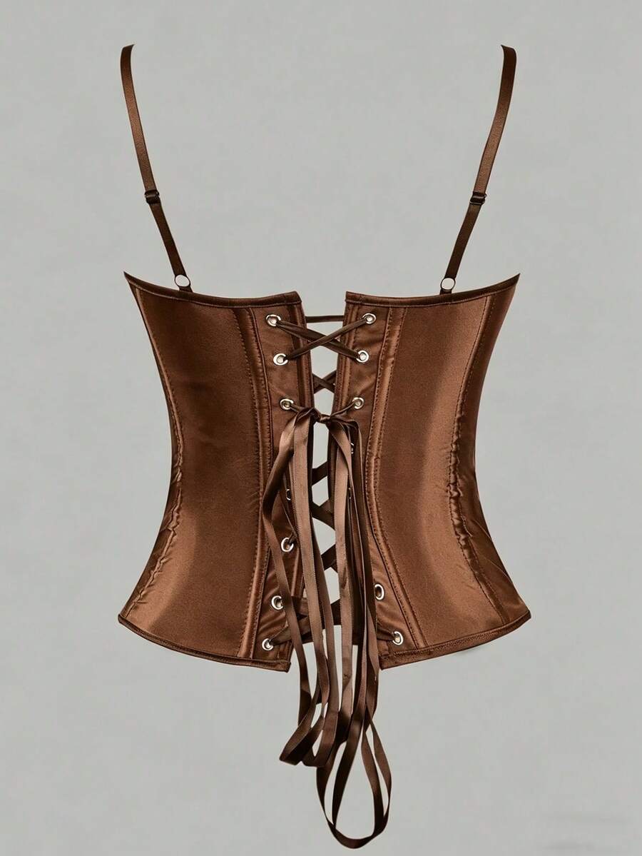 Black satin corset top for women with 3D floral rose details, boned slim-fit bodice, thin spaghetti straps, lace-up open back, and asymmetrical curved hem.