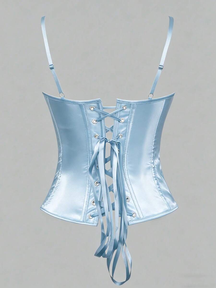 Black satin corset top for women with 3D floral rose details, boned slim-fit bodice, thin spaghetti straps, lace-up open back, and asymmetrical curved hem.