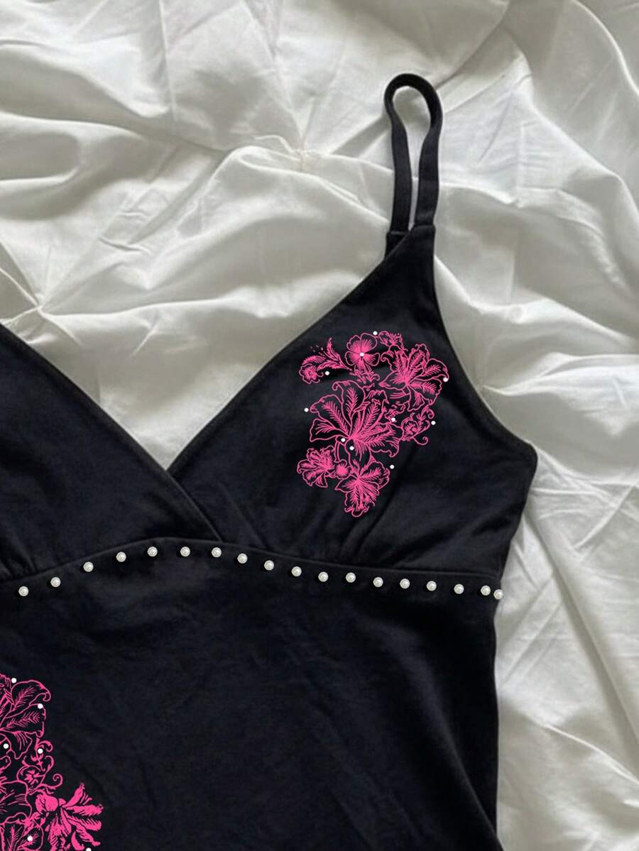 Women's slim fit spaghetti strap cami top featuring a tropical hibiscus floral graphic print.