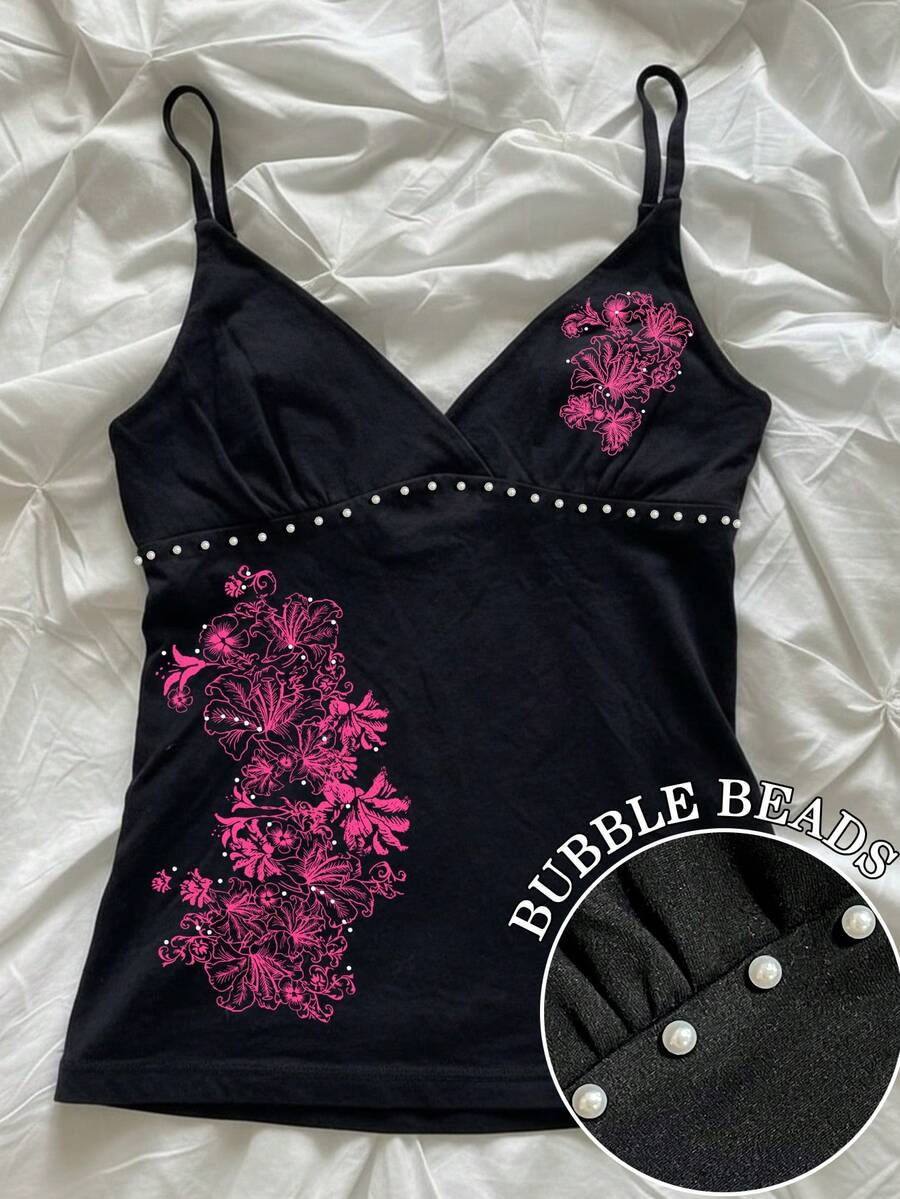 Women's slim fit spaghetti strap cami top featuring a tropical hibiscus floral graphic print.