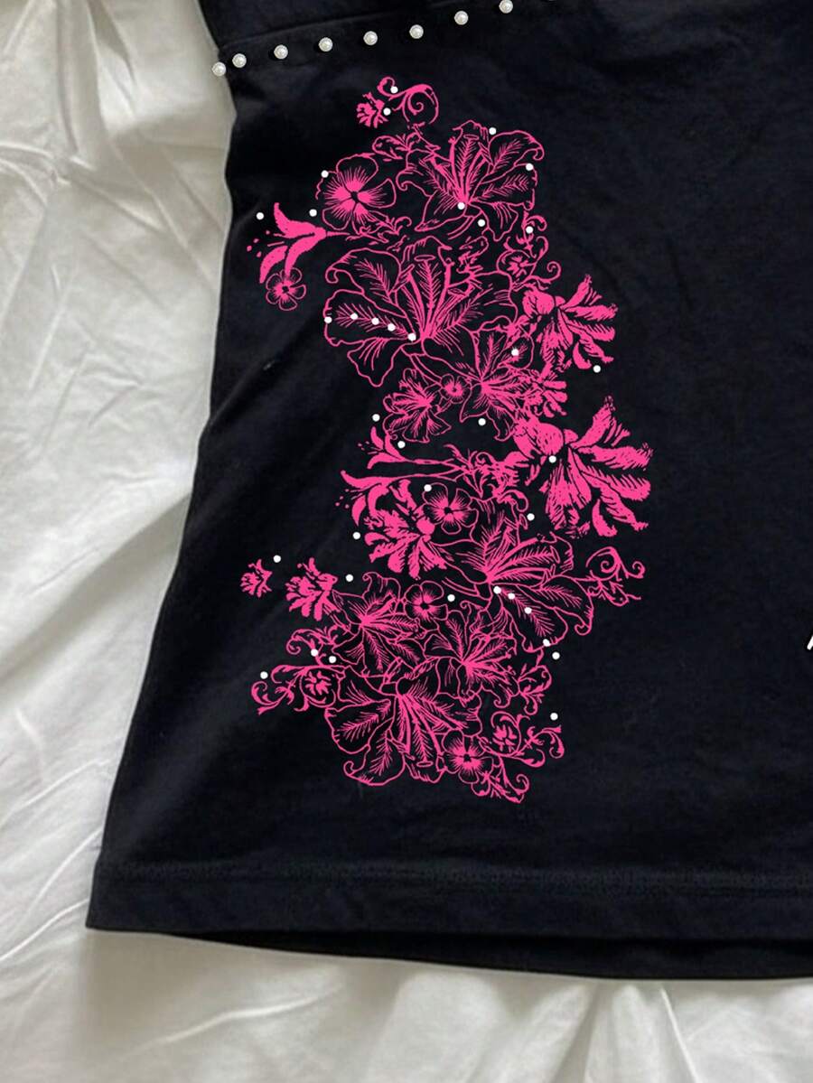 Women's slim fit spaghetti strap cami top featuring a tropical hibiscus floral graphic print.