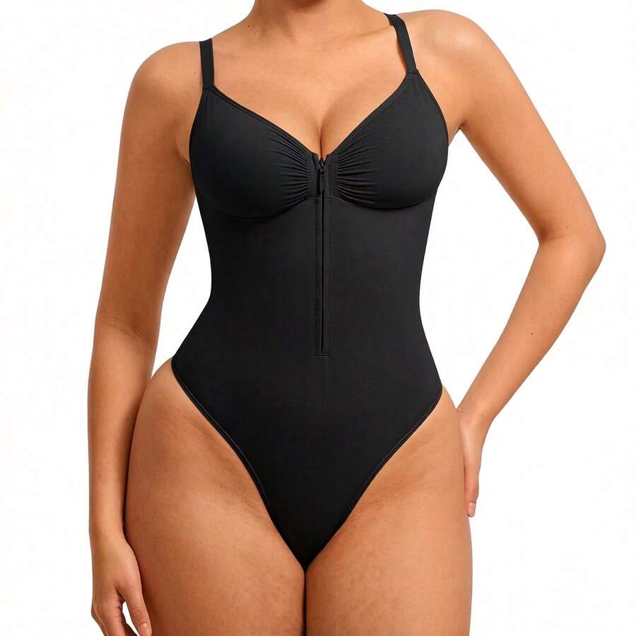 Women's V-neck camisole shapewear bodysuit featuring a front zipper closure, ruched detail, and waist shaping control.