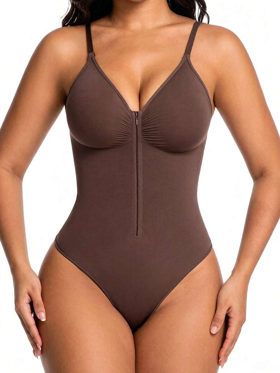 Women's V-neck camisole shapewear bodysuit featuring a front zipper closure, ruched detail, and waist shaping control.