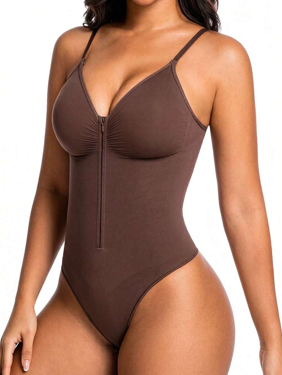 Women's V-neck camisole shapewear bodysuit featuring a front zipper closure, ruched detail, and waist shaping control.