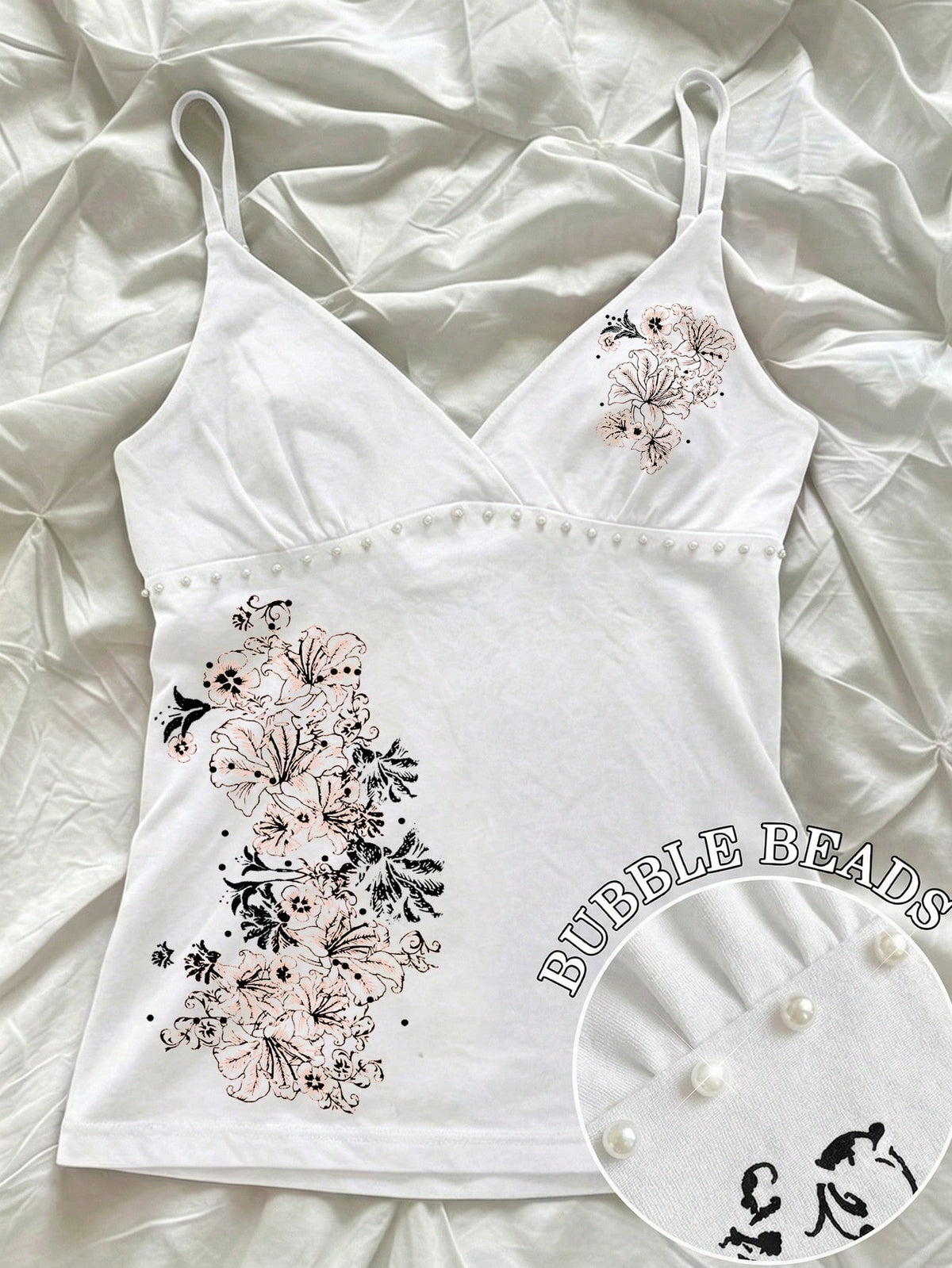 Women's slim fit spaghetti strap cami top featuring a tropical hibiscus floral graphic print.