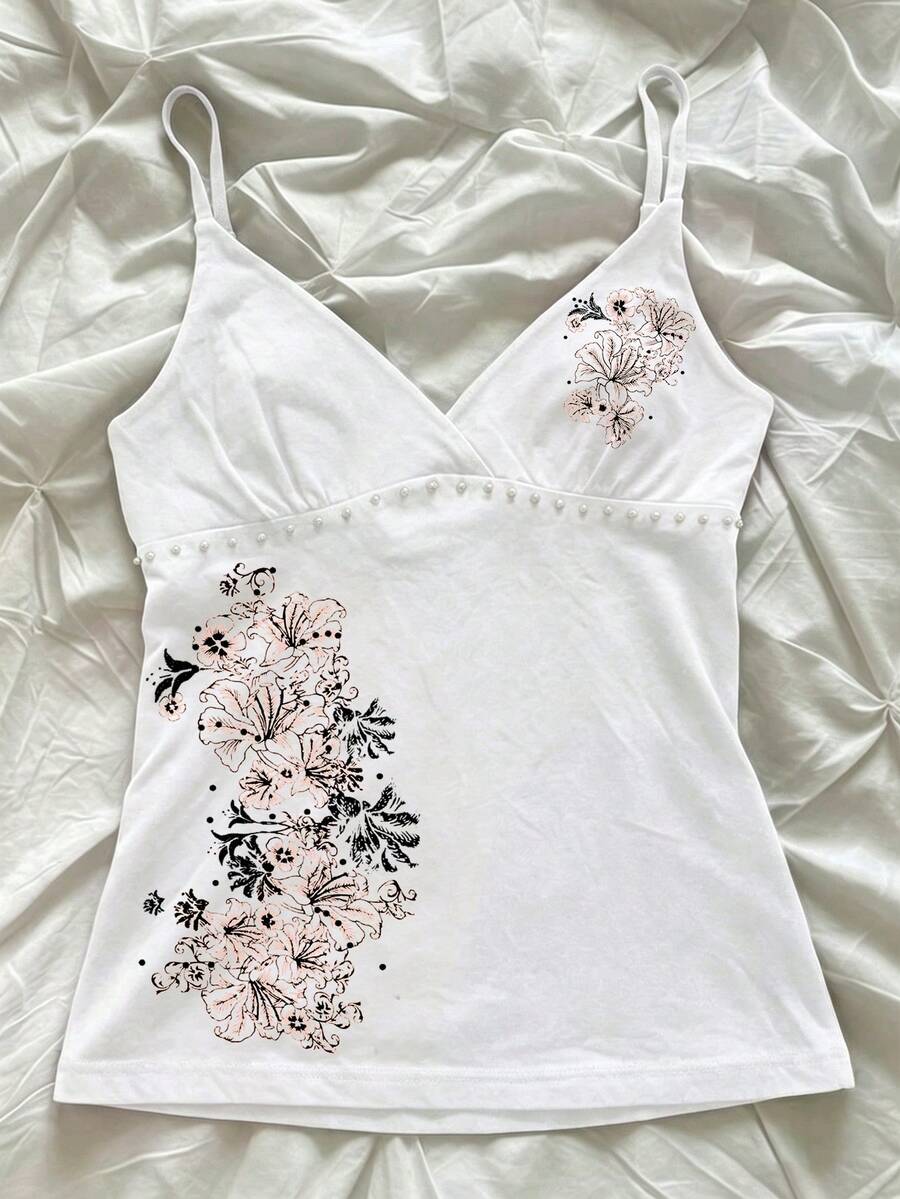 Women's slim fit spaghetti strap cami top featuring a tropical hibiscus floral graphic print.