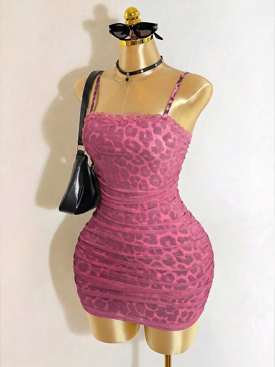 Black sleeveless mesh cami mini dress featuring spaghetti straps and slim fit design for women.