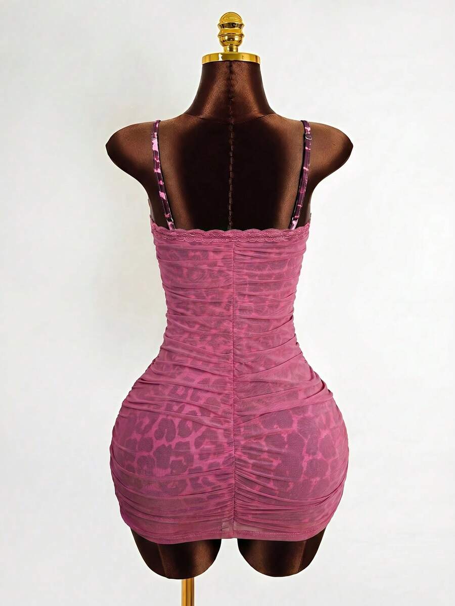 Black sleeveless mesh cami mini dress featuring spaghetti straps and slim fit design for women.