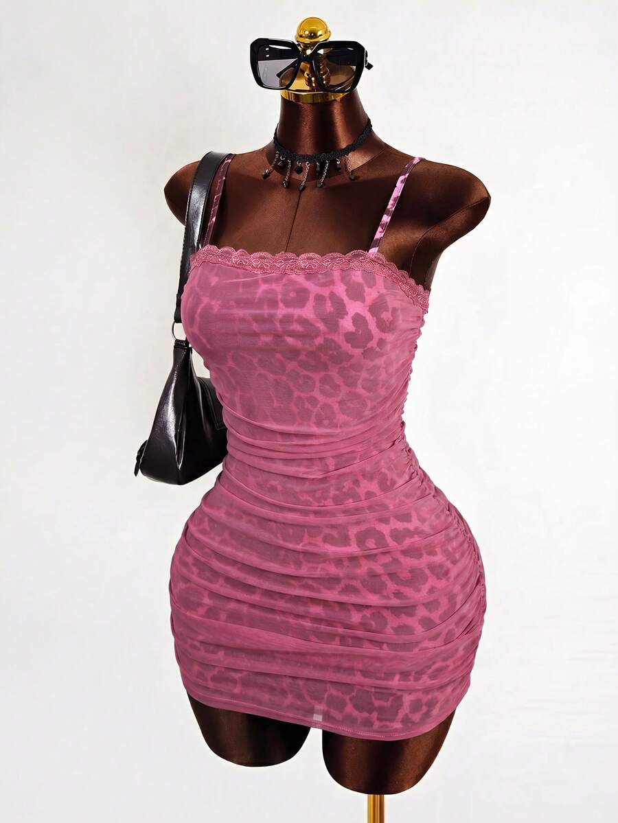 Black sleeveless mesh cami mini dress featuring spaghetti straps and slim fit design for women.