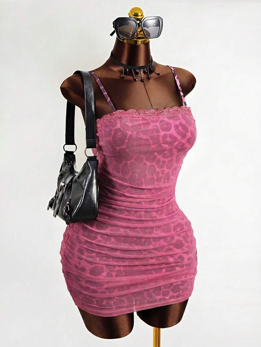 Black sleeveless mesh cami mini dress featuring spaghetti straps and slim fit design for women.