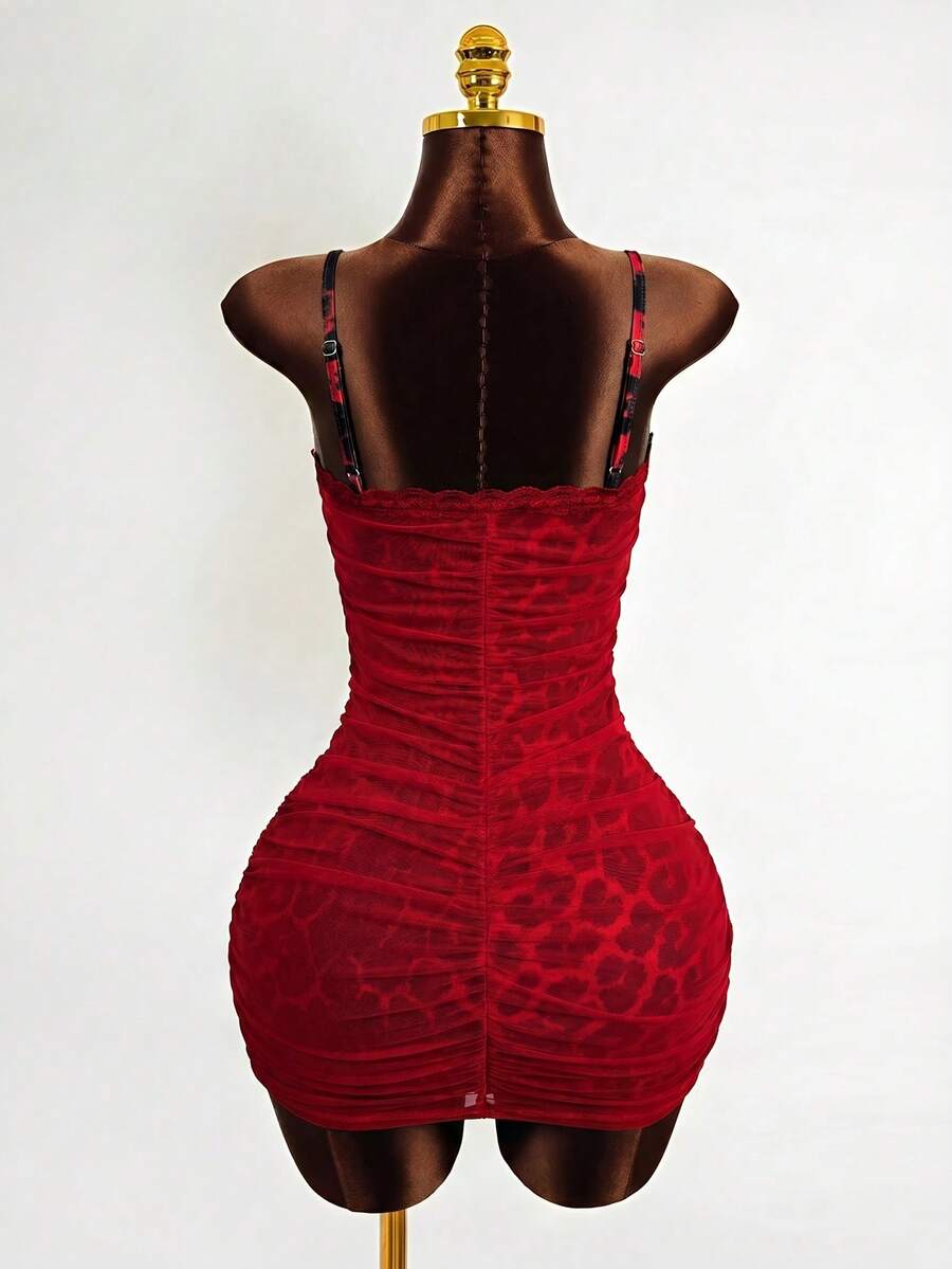 Black sleeveless mesh cami mini dress featuring spaghetti straps and slim fit design for women.