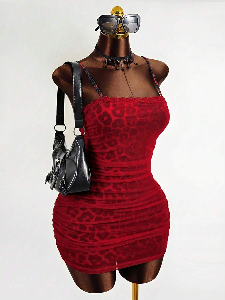 Black sleeveless mesh cami mini dress featuring spaghetti straps and slim fit design for women.
