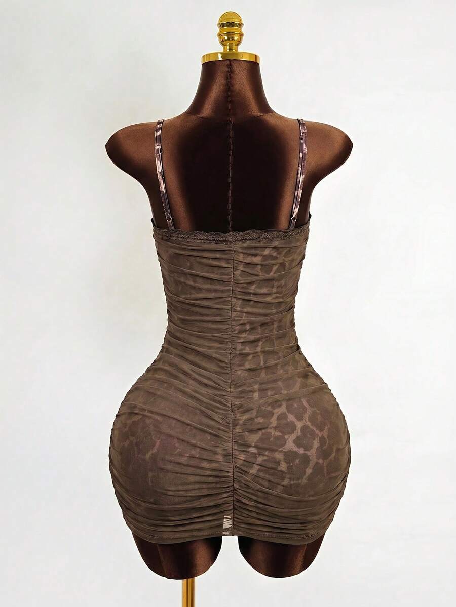Black sleeveless mesh cami mini dress featuring spaghetti straps and slim fit design for women.