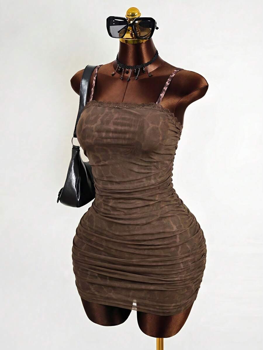 Black sleeveless mesh cami mini dress featuring spaghetti straps and slim fit design for women.