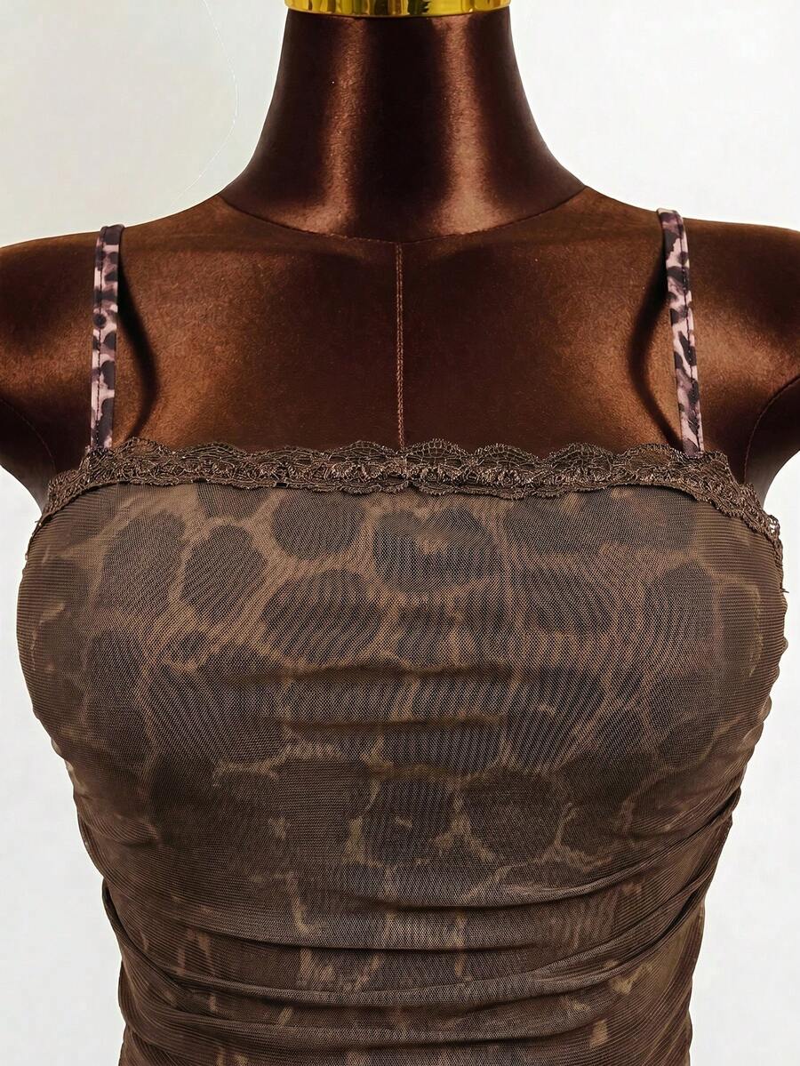Black sleeveless mesh cami mini dress featuring spaghetti straps and slim fit design for women.