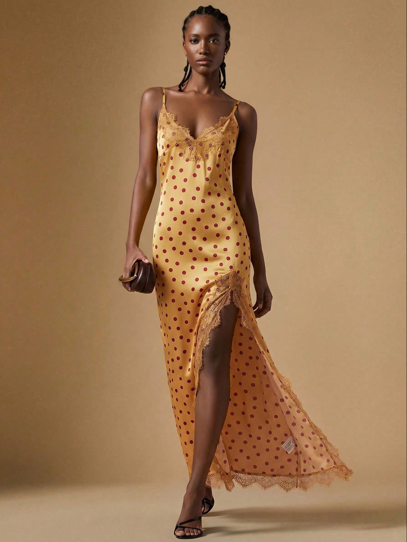 Women's black lace split satin long dress featuring spaghetti straps, asymmetrical slit hem, and matching arm sleeves.
