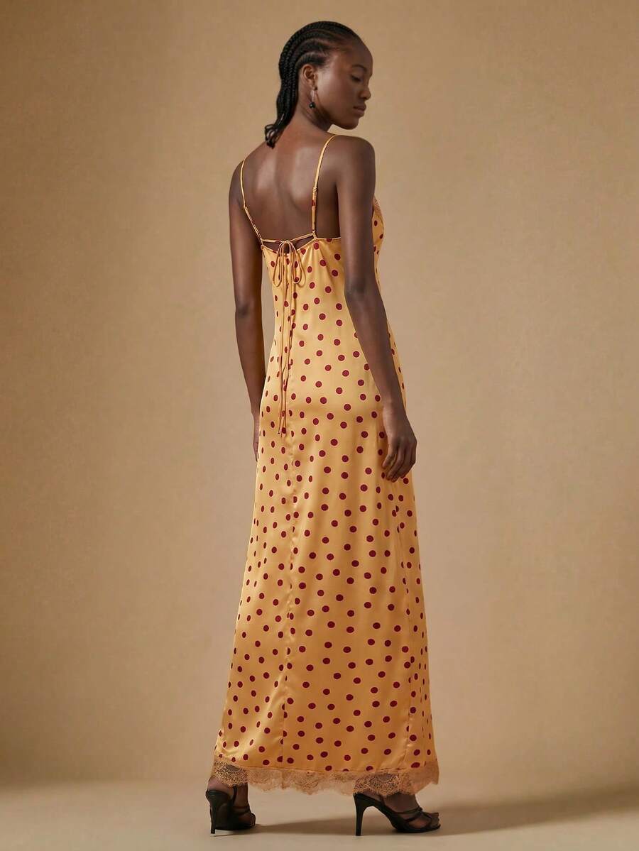 Women's black lace split satin long dress featuring spaghetti straps, asymmetrical slit hem, and matching arm sleeves.
